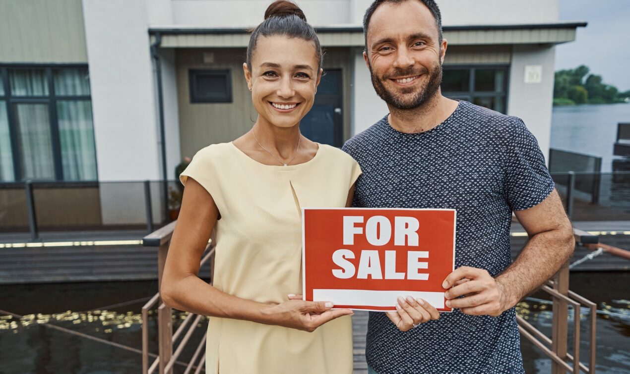 Lovely adult couple selling their beautiful home